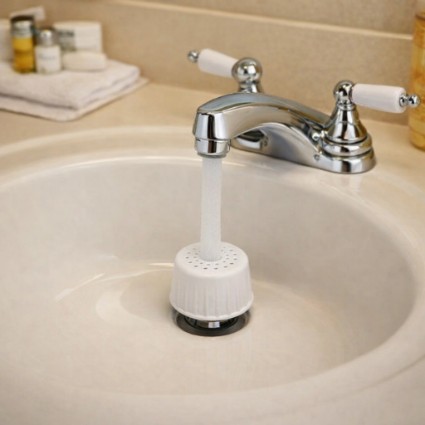 Hospitality bathroom sink setup showing splash control and spout alignment